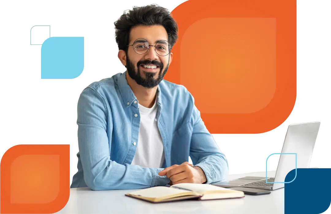 a man sits at a table with a book