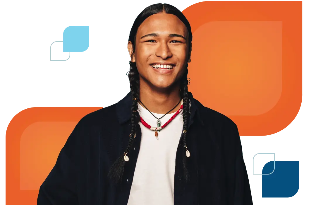 a young man smiles at the camera