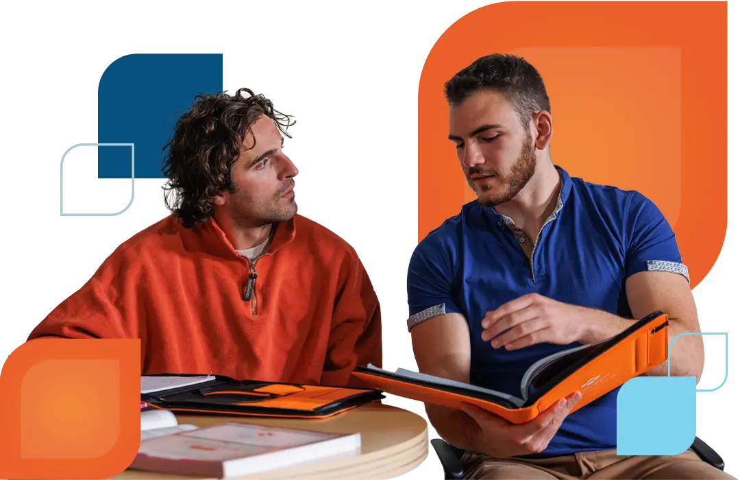 two men study MHFA with notebooks