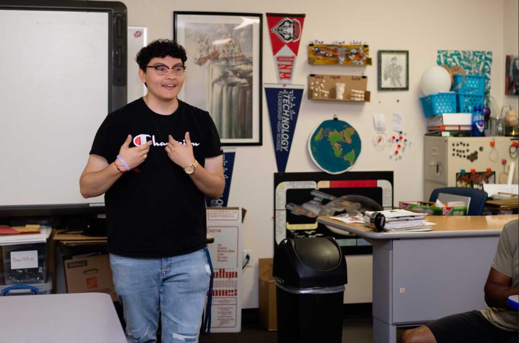 a man in a classroom speaking